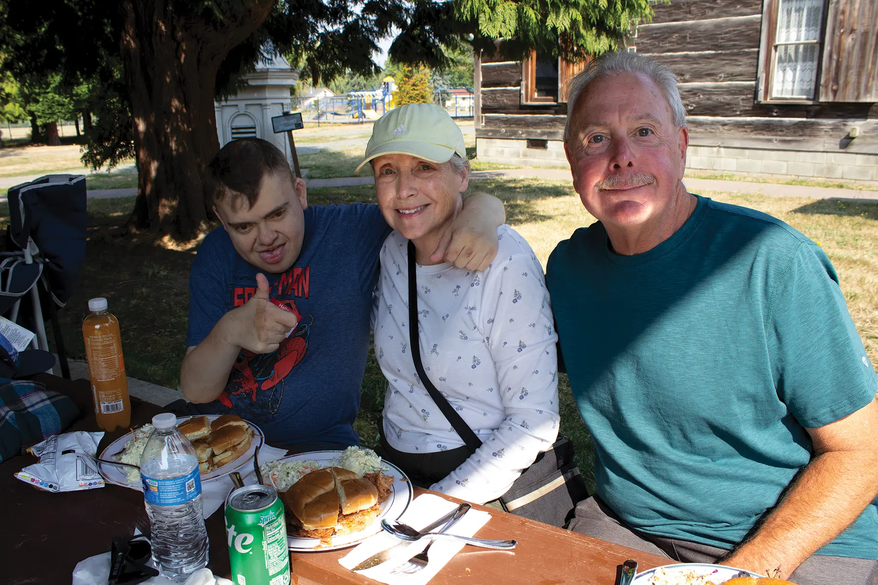 Jim and his parents at the company picnic.