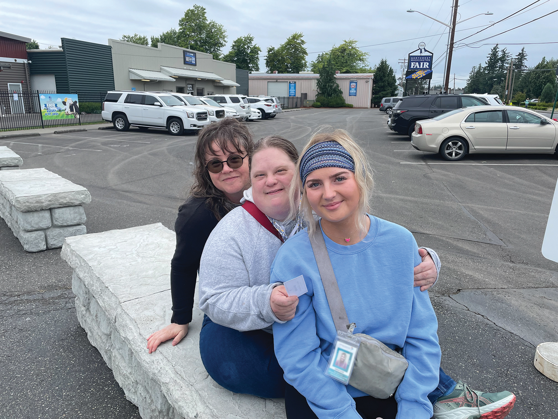 Lindsey with staff members in community.