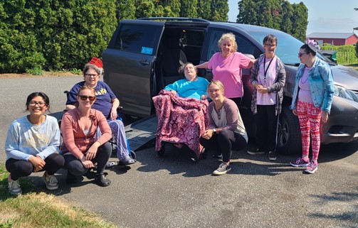 Cascade Christian Home residents in front of their wheelchair van